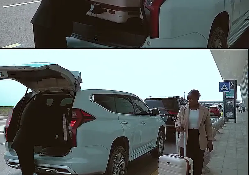 Motorista da Costa Phoebe a carregar a bagagem do cliente no aeroporto de Luanda